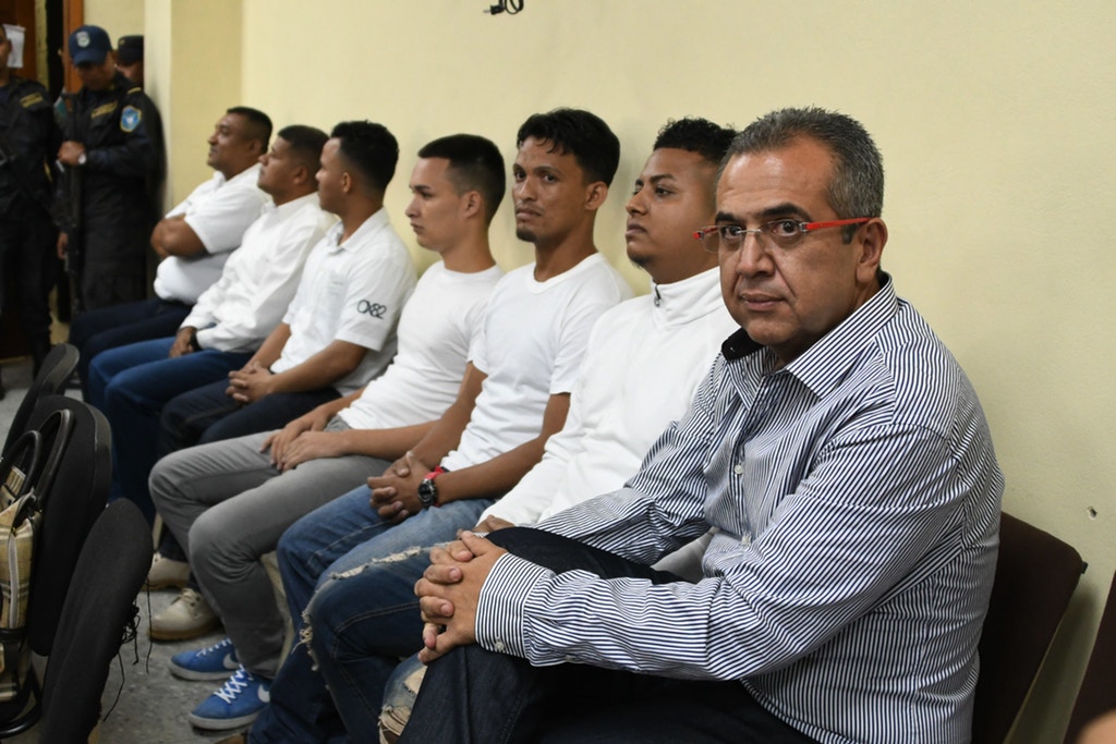 This photo taken on September 17, 2018 shows Sergio Rodriguez (R) along with six other accused on the murder of indigenous environmental activist Berta Caceres, after the judges suspended the trial following the filing of a court challenge in Tegucigalpa. - Berta Caceres' family, is expecting on November 22, 2018 that next week seven of nine accused in the activist murder will be sentenced, yet they will continue seeking for justice on the responsibility of the intellectual authors. (Photo by ORLANDO SIERRA / AFP)        (Photo credit should read ORLANDO SIERRA/AFP via Getty Images)
