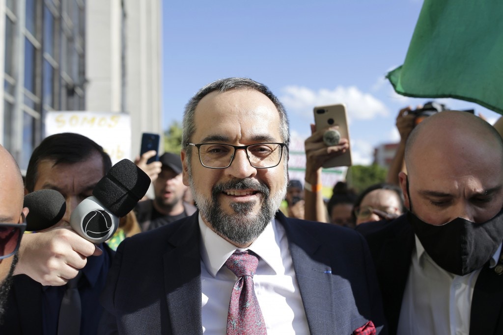 Brazil's Minister of Education, Abraham Weintraub, leaves the Federal Police headquarters building after testifying in an investigation which he answers for alleged crime of racism, in Brasilia, on June 04, 2020. On his way out, the minister was carried in his arms by supporters waiting for him in front of the venue and gave a brief speech on freedom of expression. The inquiry was opened in last April, after the minister posted a message on Twitter in which he makes fun on the accent of some Chinese when they speaking Portuguese. Photo: DIDA SAMPAIO/ESTADAO CONTEUDO (Agencia Estado via AP Images)