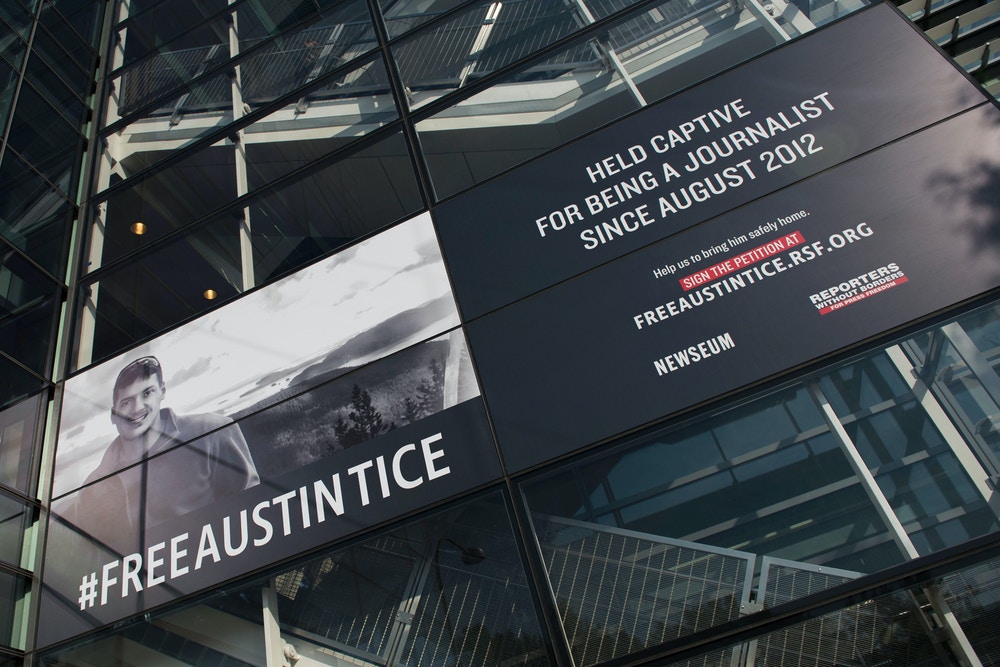 A banner calling for the release of Austin Tice, the only American journalist held captive in Syria, is displayed at the Newseum in Washington, DC on November 2, 2016.  / AFP / ANDREW CABALLERO-REYNOLDS        (Photo credit should read ANDREW CABALLERO-REYNOLDS/AFP via Getty Images)