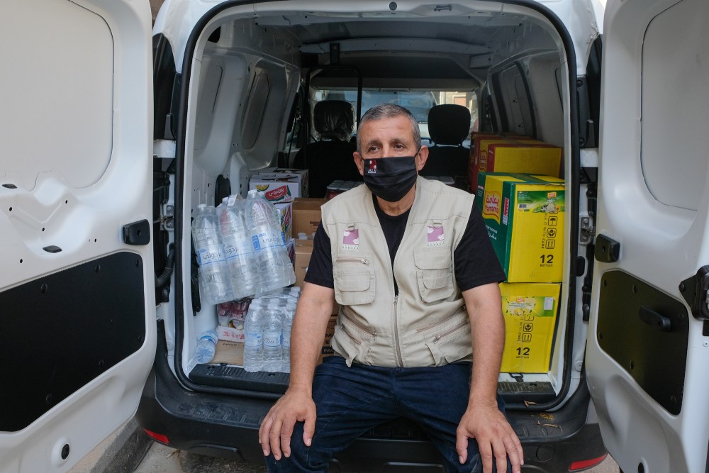 Hussein is the driver. He helps everyday for the transportation to more than thousand families in need.
