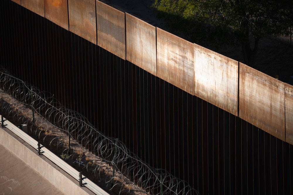 The border fence and razor wire along the Rio Grande between Ciudad Juárez, Mexico and El Paso, Texas. October 29, 2020.
