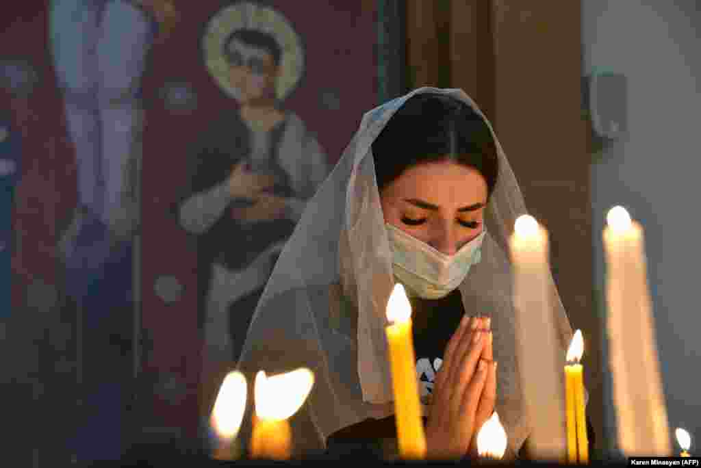 A woman prays in a church in Yerevan on October 17.&nbsp;