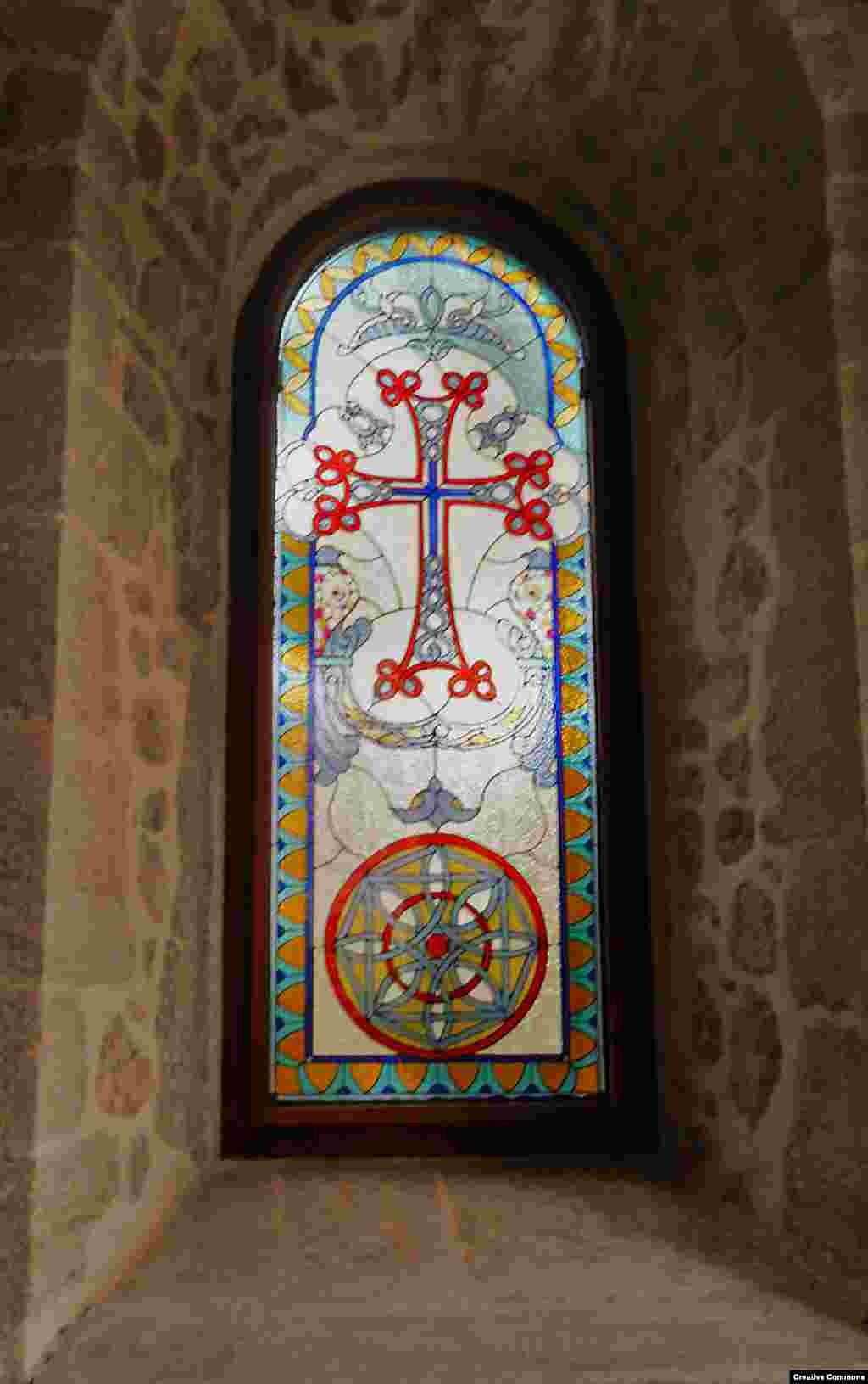 Light shines through a stained-glass window inside Kanach Zham. The church was built in 1818. &nbsp;
