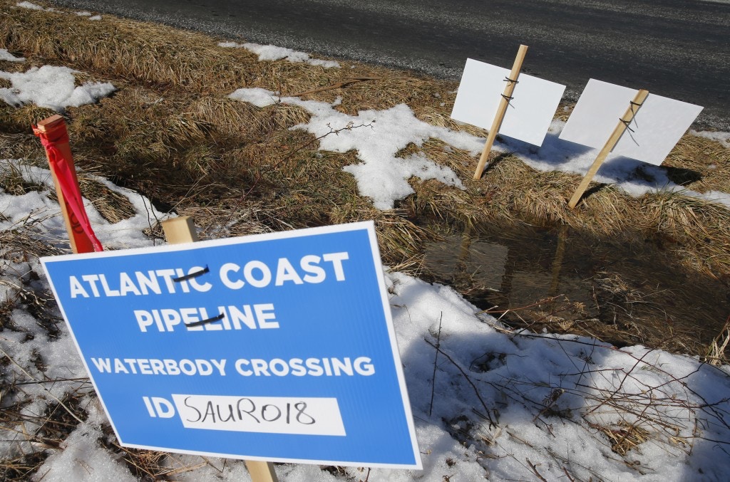 This photo shows signs that mark the route of the Atlantic Coast Pipeline in Deerfield, Va. on Feb. 8, 2018.