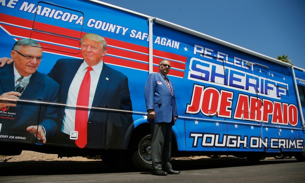 Former Maricopa County Sheriff Joe Arpaio, poses for a photograph in front of his campaign vehicle as he is running for the position of Maricopa County Sheriff again, Wednesday, July 22, 2020, in Fountain Hills, Ariz. Arpaio is trying to win back the sheriff’s post in metro Phoenix that he held for 24 years. He faces his former second-in-command, Jerry Sheridan, in the Aug. 4 Republican primary in what has become his second comeback bid. (AP Photo/Ross D. Franklin)