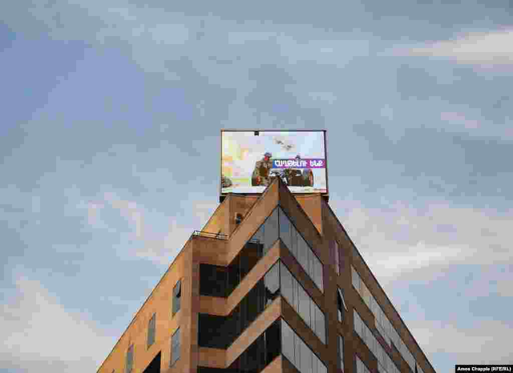 A photo of a now-deceased Armenian soldier on a building in central Yerevan on October 28.&nbsp;