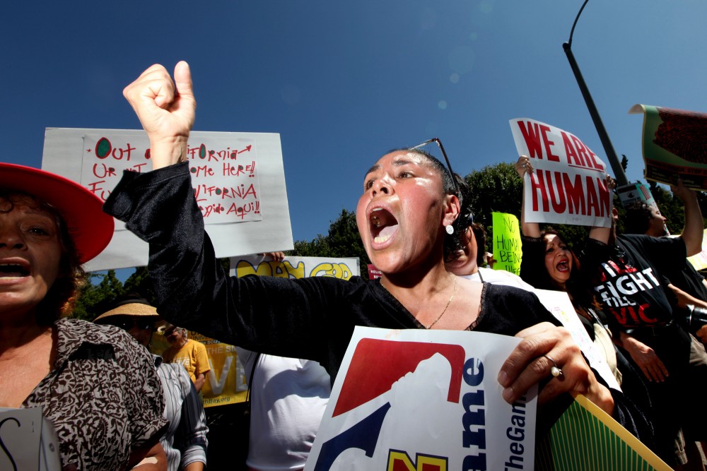 Demonstrators Protest Against AZ Sheriff Arpaio During His Visit To CA