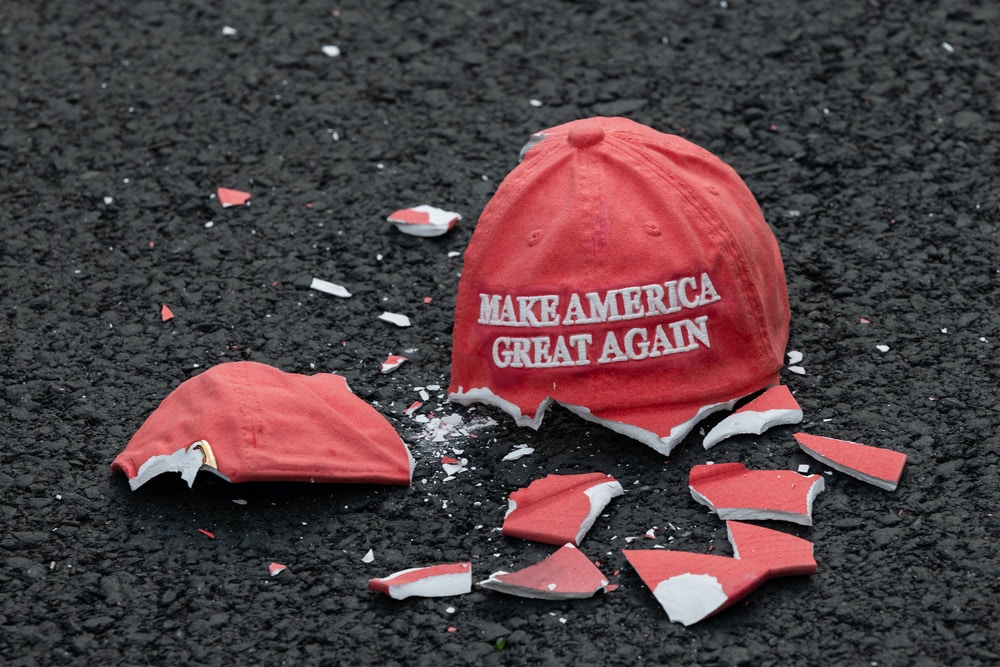 A ceramic "Make America Great Again" hat lies broken in Black Lives Matter Plaza during the 2020 Presidential election in Washington, D.C., U.S., on Tuesday, Nov. 3, 2020. The election is taking place amid a third deadly wave in the pandemic, warnings about renewed foreign interference and a political environment even more polarized than in 2016, with both sides warning that a vote for the other risks plunging the country into ruin. Photographer: Eric Lee/Bloomberg via Getty Images