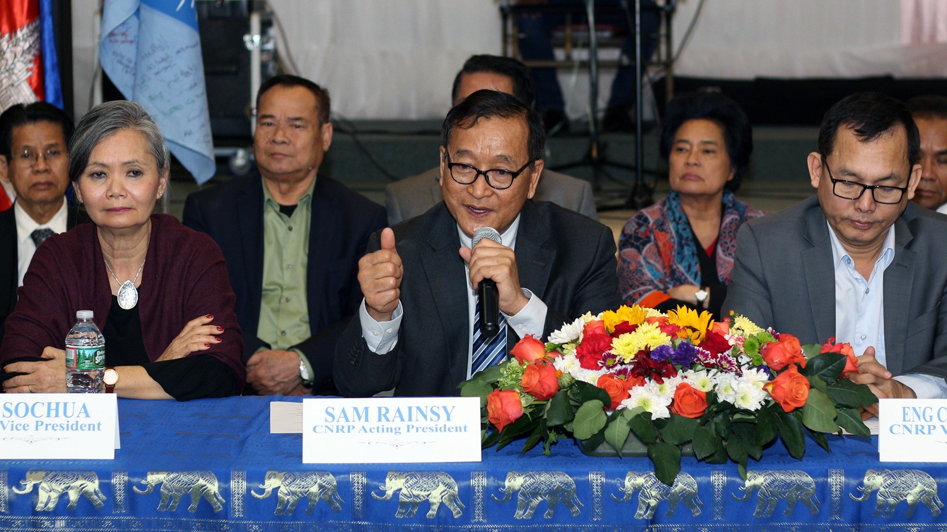 Sam Rainsy (C), Mu Sochua (L), and Eng Chhay Eang (R) speak to reporters during a press conference in the U.S., March 17, 2019.