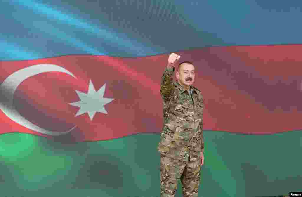 Azerbaijani President Ilham Aliyev gestures as he makes a televised address on November 8 announcing the capture of Shushi/Susa.&nbsp;