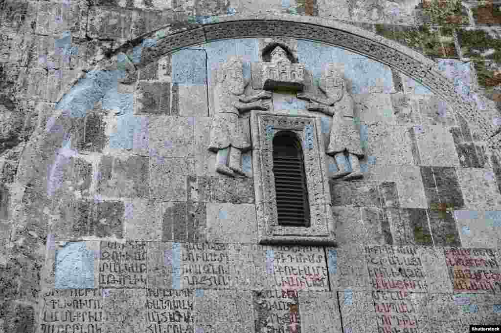 Details of a stone carving and Armenian script inside Dadivank. The monastery was completed in the 13th century. &nbsp;