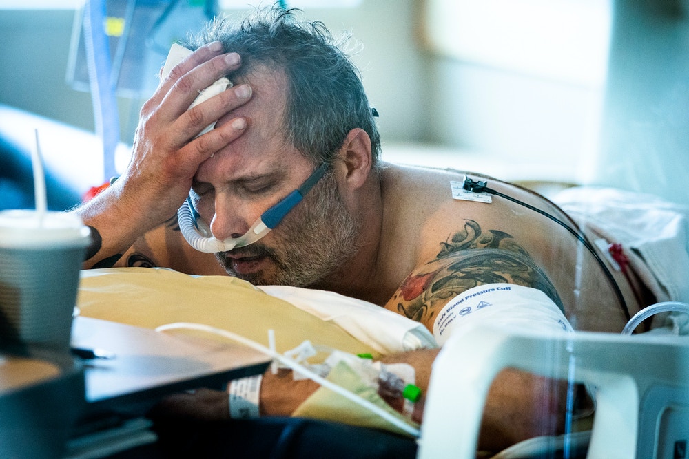 ST PAUL, MN - NOV. 19: COVID-19 patient Michael Wright lay in his bed in the prone position to increase oxygenation while in the ICU at Regions Hospital in St. Paul. Wright passed away in December. (Photo by Leila Navidi/Star Tribune via Getty Images)