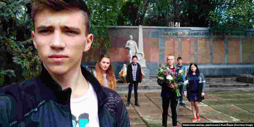 Young locals pay their respects at one of Novhorodske&rsquo;s war memorials. &nbsp; Shevchenko added: &ldquo;We are very much waiting for a positive decision from parliament. We overcame a difficult and thorny path to have our history heard.&rdquo;