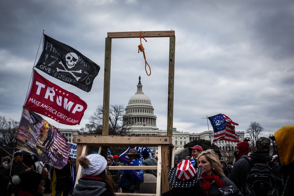 Trump supporters near the  U.S Capitol, on January 06, 2021 in Washington, DC. The protesters stormed the historic building, breaking windows and clashing with police. Trump supporters had gathered in the nation's capital today to protest the ratification of President-elect Joe Biden's Electoral College victory over President Trump in the 2020 election.  (Photo by Shay Horse/NurPhoto via Getty Images)