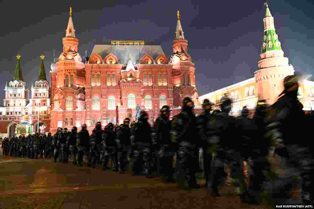 Security forces march through Moscow's Manezh Square.