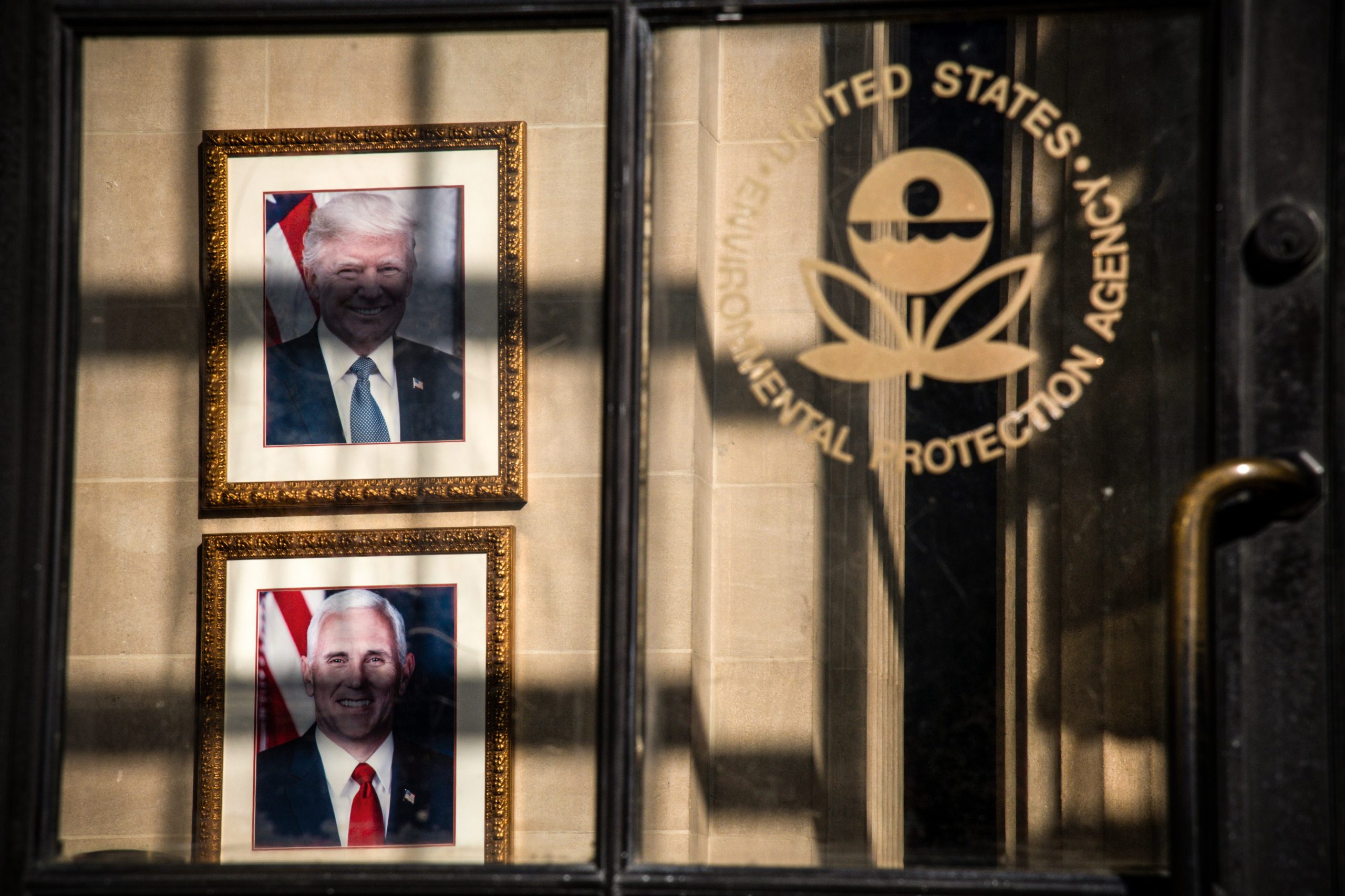 A detail view of the U.S. Environmental Protection Agency (EPA), with the portraits of President Donald Trump and Vice President Mike Pence hanging inside the doorway, in Washington, D.C., on November 20, 2020, amid the coronavirus pandemic. As confirmed COVID-19 case counts soar with the country experiencing exponential growth, President Donald Trump continues to deny the Biden Transition team access to government funding and data. (Graeme Sloan/Sipa USA)(Sipa via AP Images)