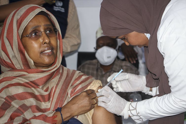 Somalian woman receives vaccine dose