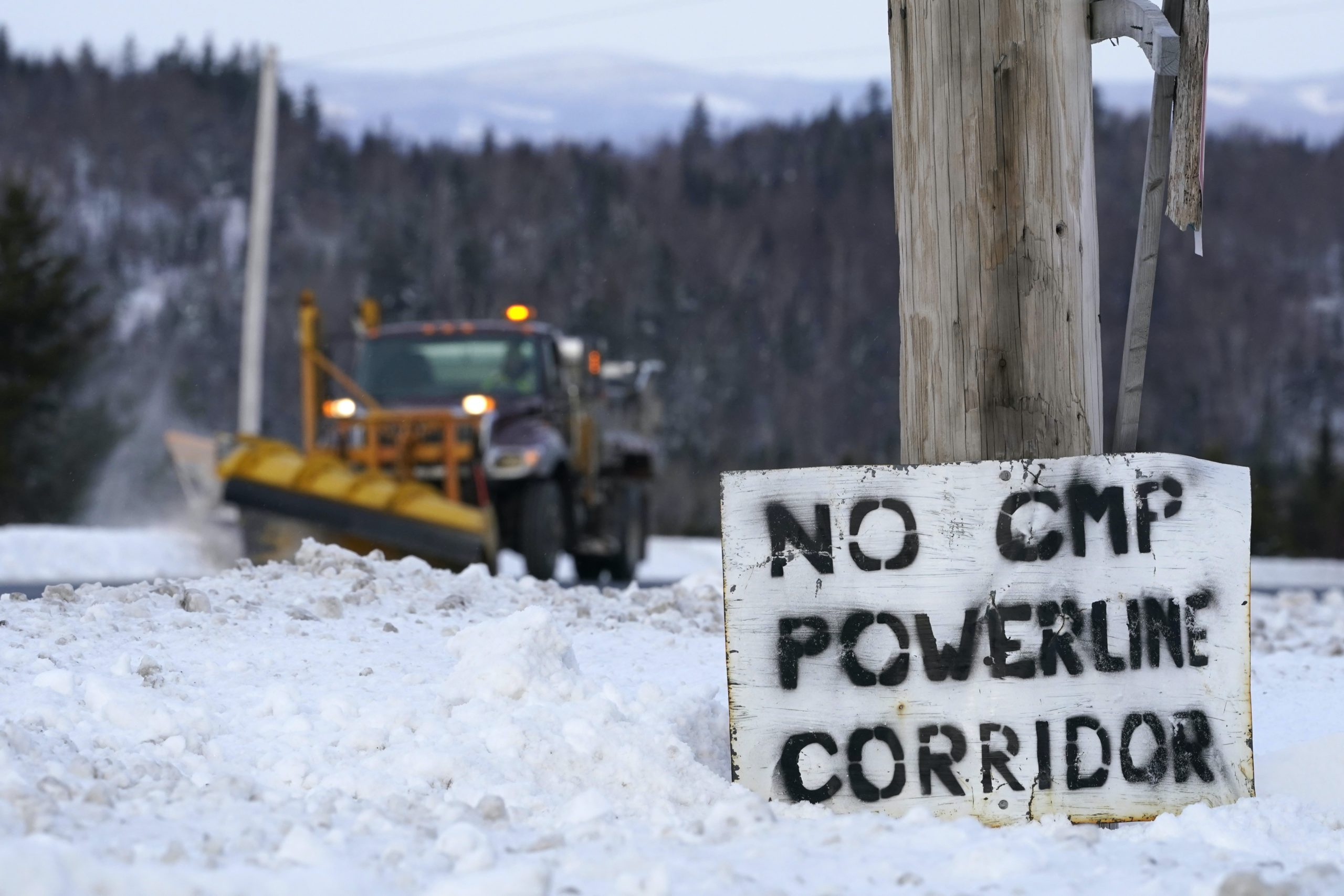 A sign in protest of Central Maine Power's controversial hydropower transmission corridor is displayed along Rte. 201 near The Forks, Maine, on Feb. 9, 2021.