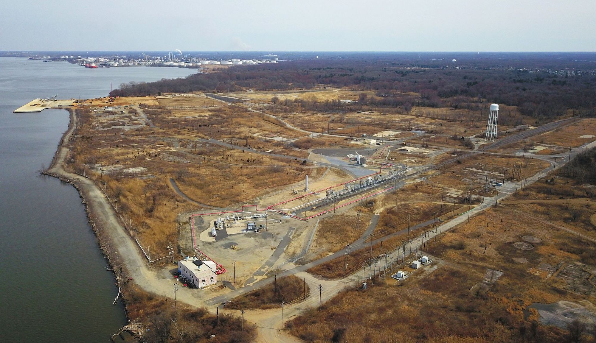 an aerial view of a mostly empty lot surrounded by brown landscape
